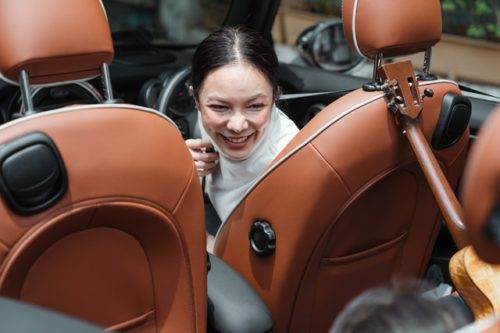 woman smiling in car